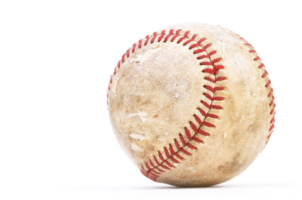 Dirty baseball isolated on white, close-up